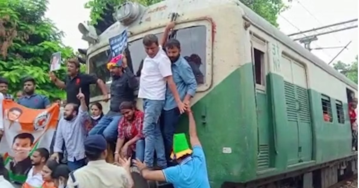 Mumbai: Congress workers attempt to stop train during protests against ED